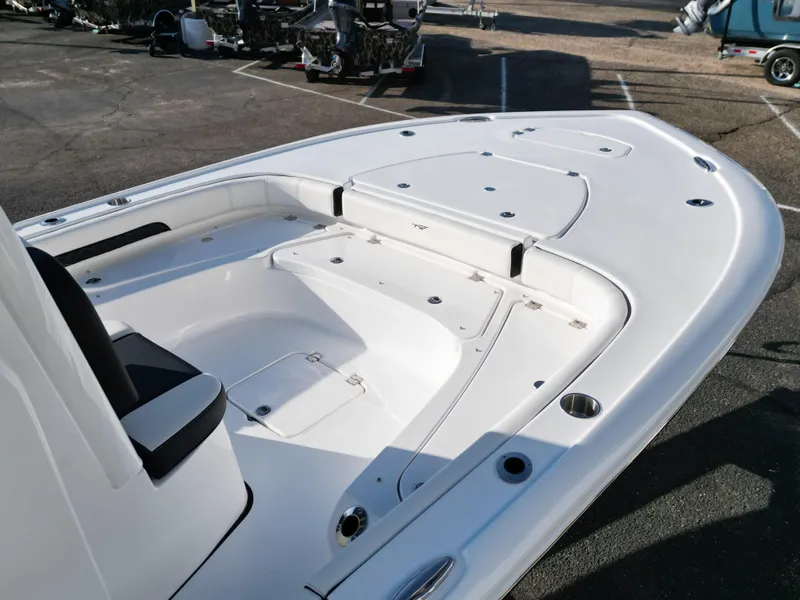 Slide: The Image of 2025 Tidewater 2500CB boat deck, featuring spacious seating and storage compartments. - 16