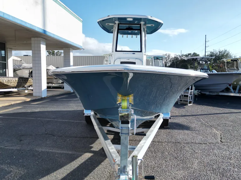 Slide: The Image of 2025 Tidewater 2500CB boat on trailer, displayed outdoors at dealership. - 17
