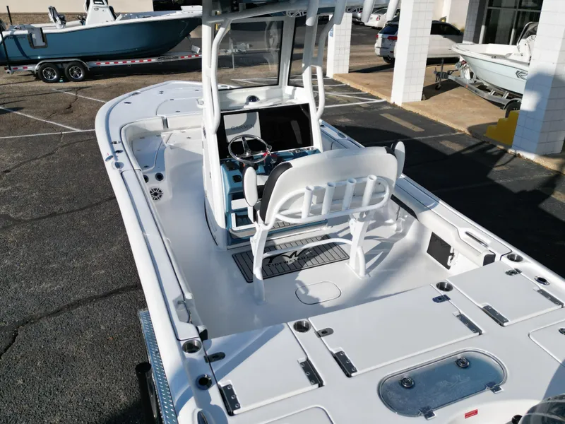 Slide: The Image of 2025 Tidewater 2500CB boat, white interior, advanced navigation, parked outdoors. - 19