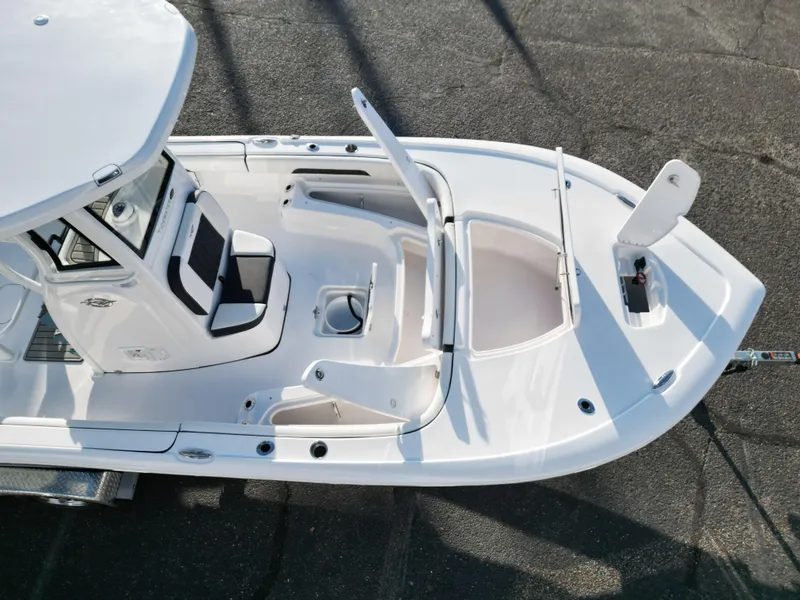 Slide: The Image of 2025 Tidewater 2500CB boat, aerial view, showcasing seating and storage compartments. - 22