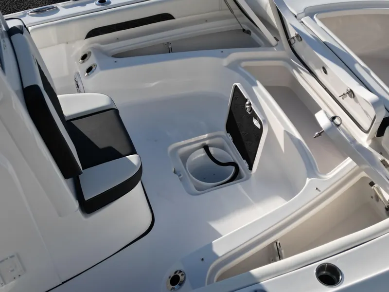 Slide: The Image of 2025 Tidewater 2500CB boat interior with seating and storage compartments. - 23