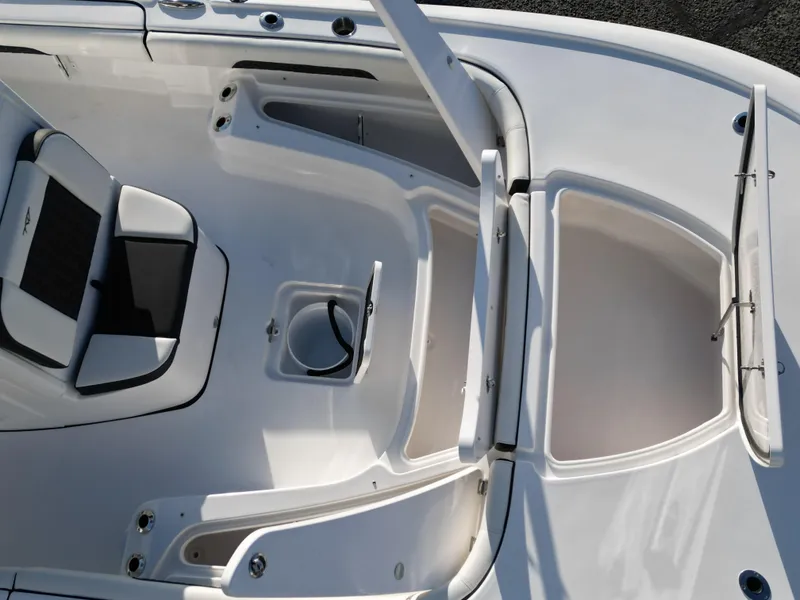 Slide: The Image of 2025 Tidewater 2500CB boat interior with seating and storage compartments. - 24