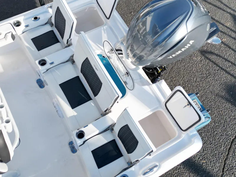 Slide: The Image of 2025 Tidewater 2500CB boat with Yamaha engine, featuring spacious seating and storage compartments. - 27