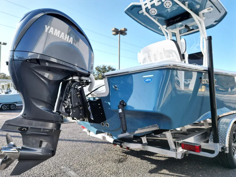 Slide: The Image of 2025 Tidewater 2500CB boat with Yamaha outboard motor on a trailer. - 6