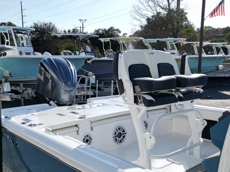 Slide: The Image of 2025 Tidewater 2500CB boat with Yamaha engine, featuring dual seating and sleek design. - 9