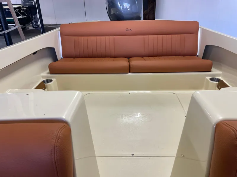 Slide: The Image of 2023 Rossiter Runabout 17 interior with brown leather seating and cup holders. - 6