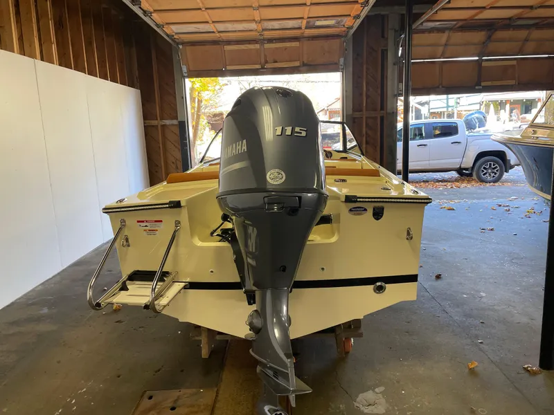 Slide: The Image of 2023 Rossiter Runabout 17 with Yamaha 115 engine in a garage setting. - 8