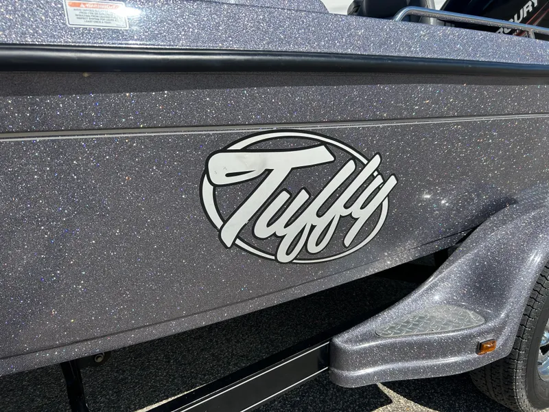 Slide: The Image of 2014 Tuffy 1760 Osprey boat with metallic finish and logo detail. - 18