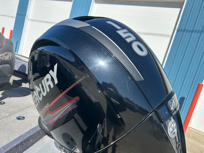 Slide: The Image of Outboard motor on 2014 Tuffy 1760 Osprey boat, featuring Mercury branding. - 20