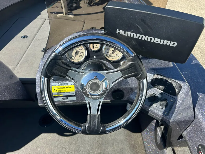 Slide: The Image of Steering wheel and dashboard of 2014 Tuffy 1760 Osprey boat with Humminbird display. - 23