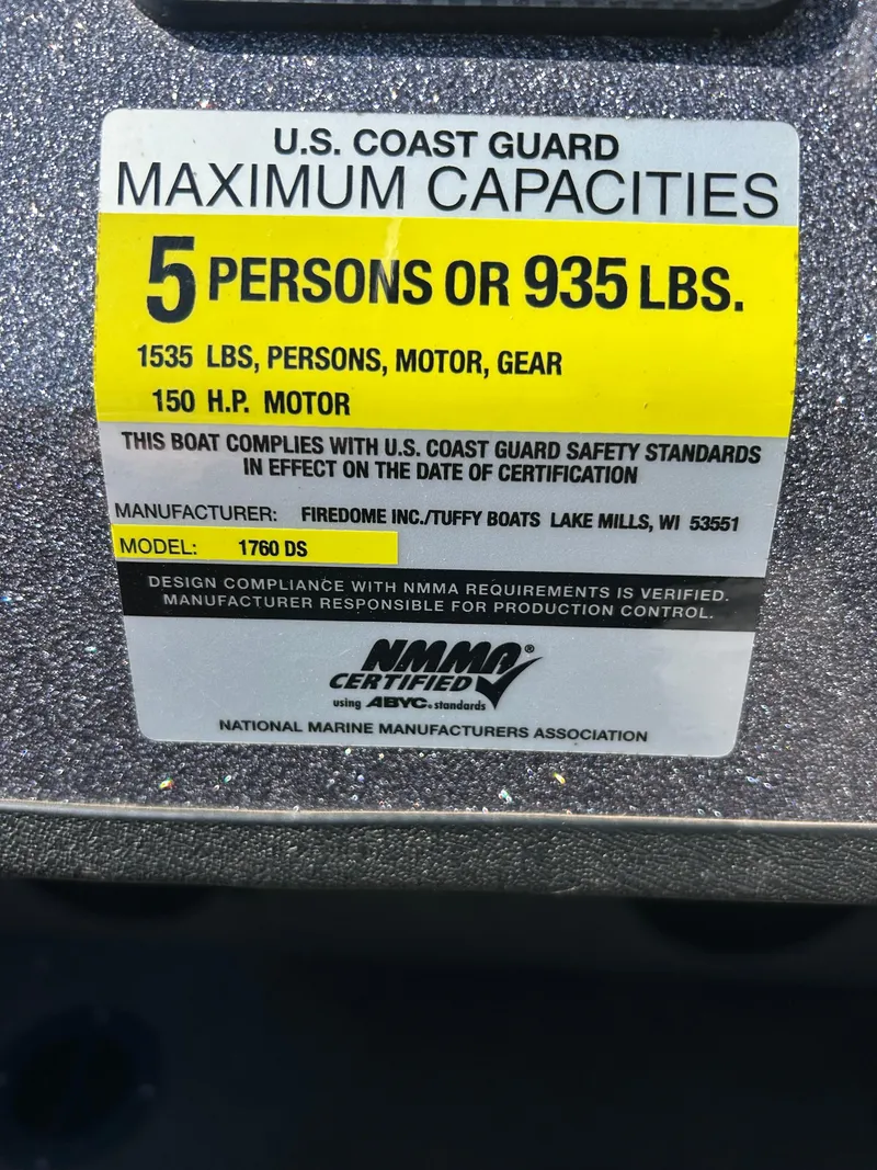 Slide: The Image of U.S. Coast Guard capacity label for 2014 Tuffy 1760 Osprey boat, 5 persons or 935 lbs. - 27
