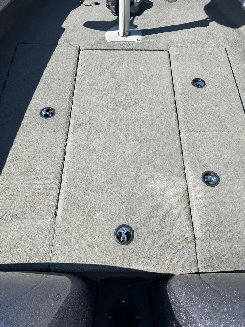 Slide: The Image of 2014 Tuffy 1760 Osprey boat deck with storage compartments and seat base. - 35