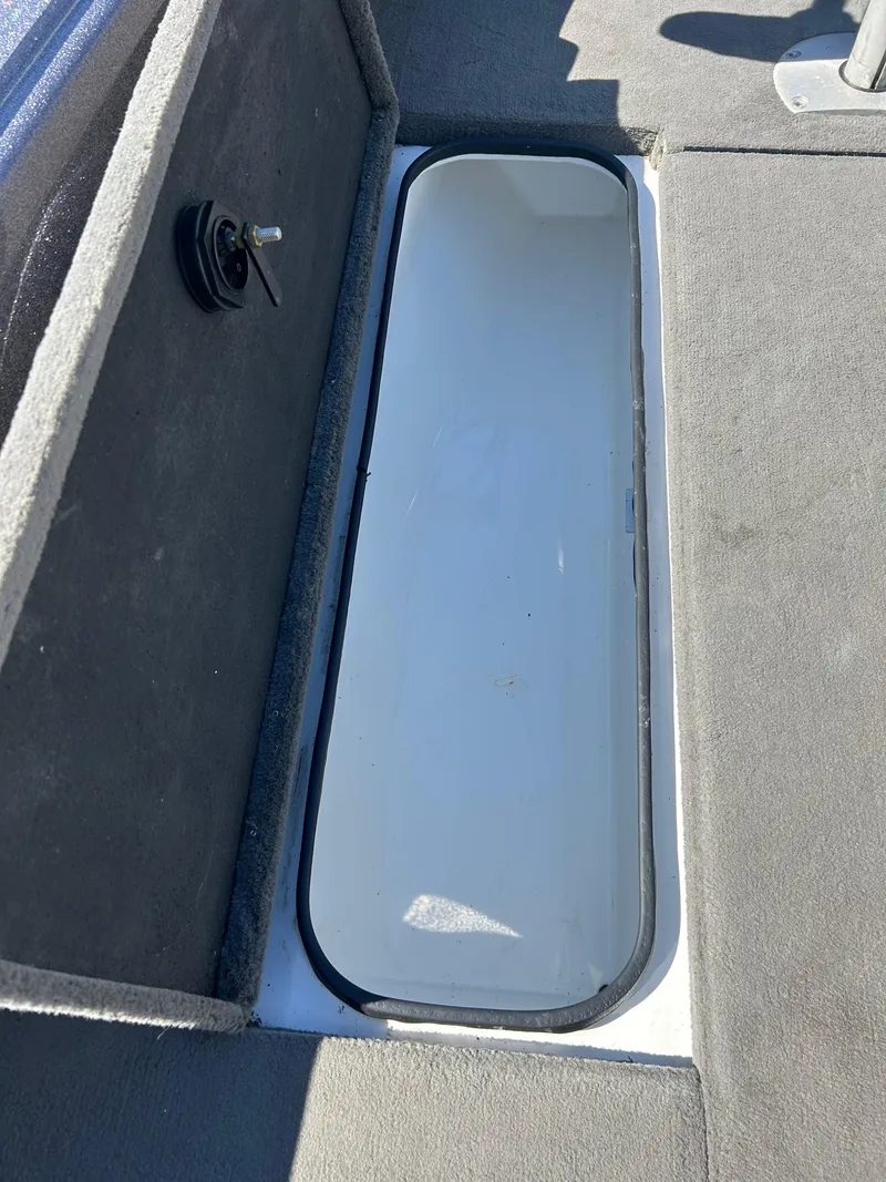 Slide: The Image of 2014 Tuffy 1760 Osprey boat storage compartment, open and empty. - 38