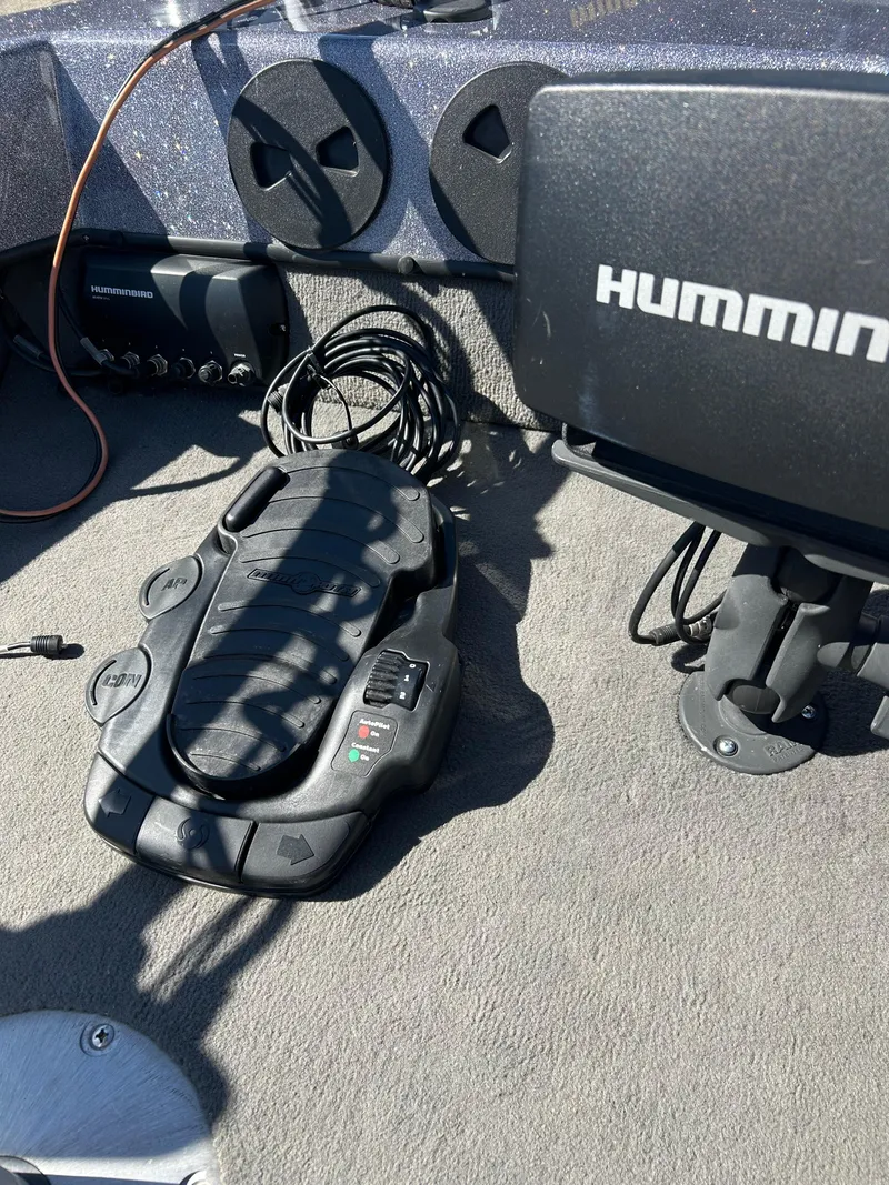 Slide: The Image of 2014 Tuffy 1760 Osprey boat dashboard with Humminbird electronics and foot pedal controls. - 39