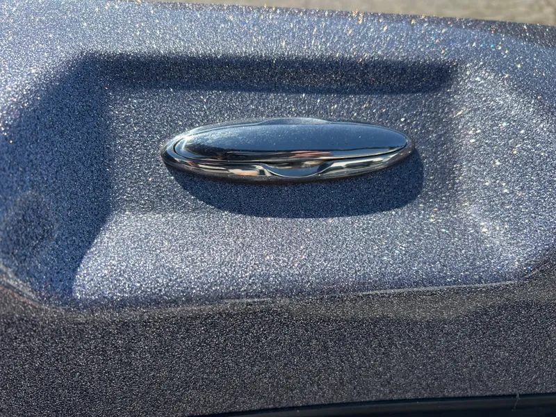 Slide: The Image of 2014 Tuffy 1760 Osprey boat detail with metallic finish and chrome handle. - 42