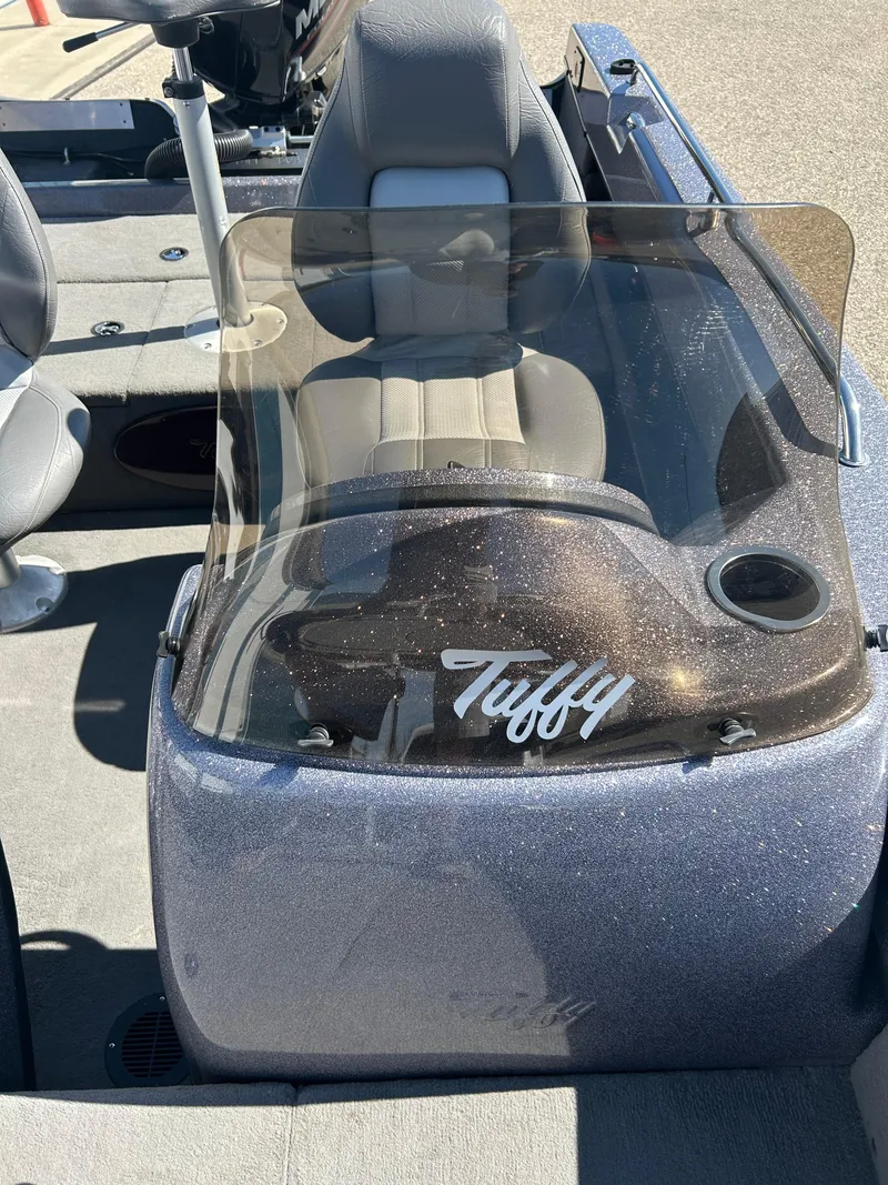Slide: The Image of 2014 Tuffy 1760 Osprey boat interior with windshield and seating. - 44