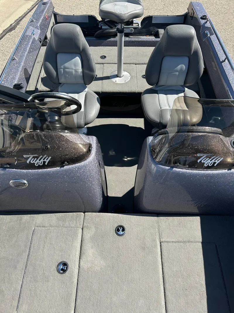 Slide: The Image of 2014 Tuffy 1760 Osprey boat interior with dual seats and steering wheel. - 45