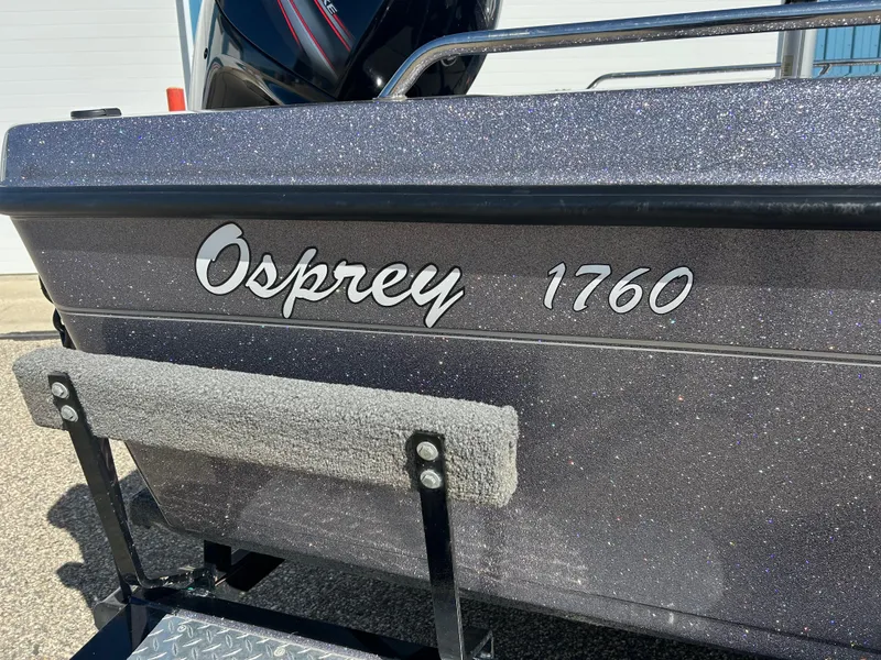 Slide: The Image of 2014 Tuffy 1760 Osprey boat with metallic finish and step ladder. - 7