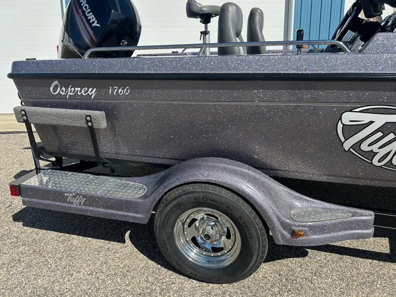 Slide: The Image of 2014 Tuffy 1760 Osprey boat trailer with metallic finish and Mercury engine. - 9
