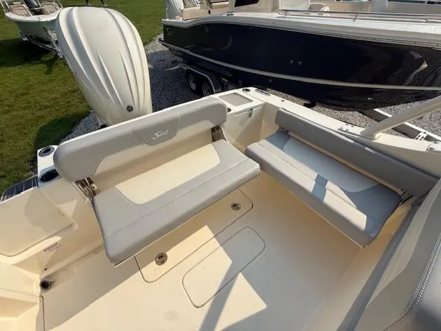 Slide: The Image of 2025 Scout 240 Dorado boat interior with cushioned seating and sleek design. - 7
