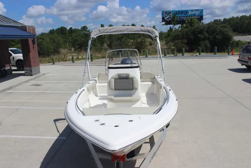 Slide: The Image of 2025 Key West 189 FS boat in parking lot under clear sky. - 11