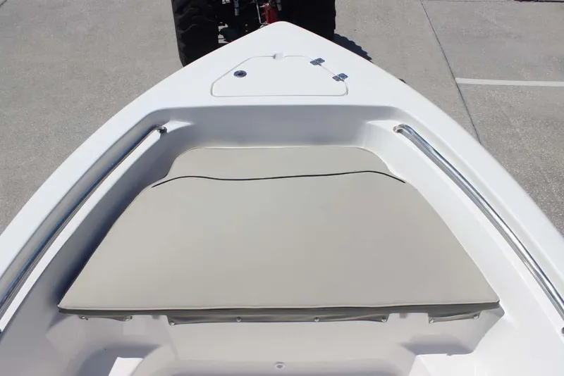Slide: The Image of 2025 Key West 189 FS boat bow with cushioned seating and storage compartment. - 13