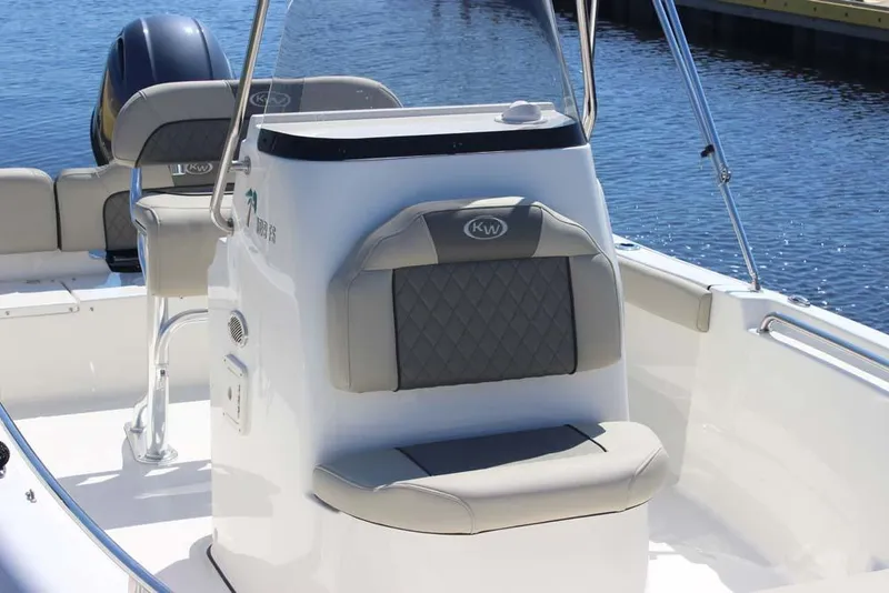 Slide: The Image of 2025 Key West 189 FS boat interior with cushioned seating and steering console. - 6