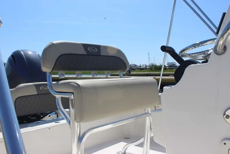 Slide: The Image of 2025 Key West 189 FS boat interior with steering wheel and seating. - 8