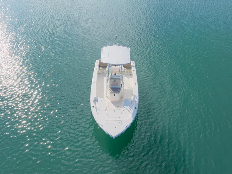 Slide: The Image of Aerial view of 2022 Pathfinder 2005 TRS boat on calm, turquoise water. - 10