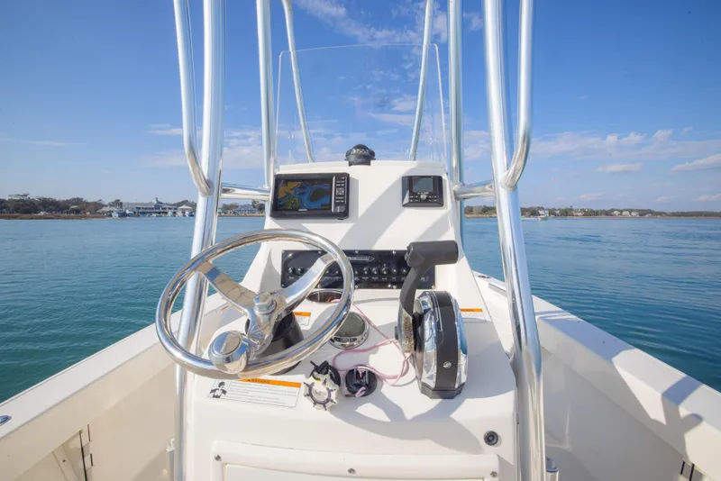 Slide: The Image of Center console of a 2022 Pathfinder 2005 TRS boat on calm water. - 19