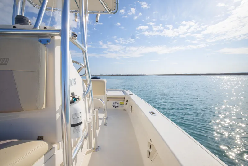 Slide: The Image of Pathfinder 2005 TRS boat on calm water under a sunny sky, 2022 model. - 25