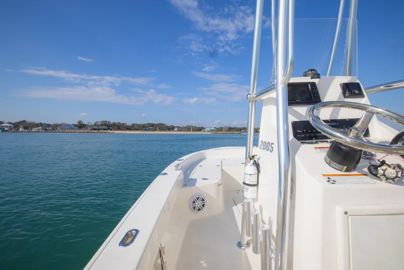 Slide: The Image of Pathfinder 2005 TRS boat on calm water, clear sky, coastal view, 2022 model. - 28