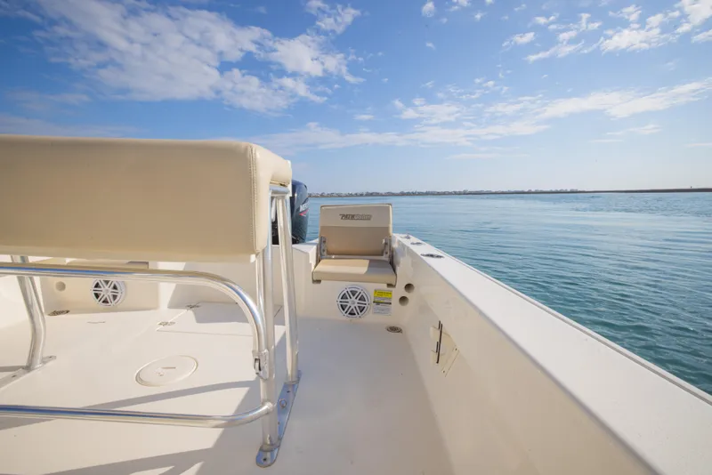 Slide: The Image of Pathfinder 2005 TRS boat interior with seating, ocean view, and clear blue sky. - 30