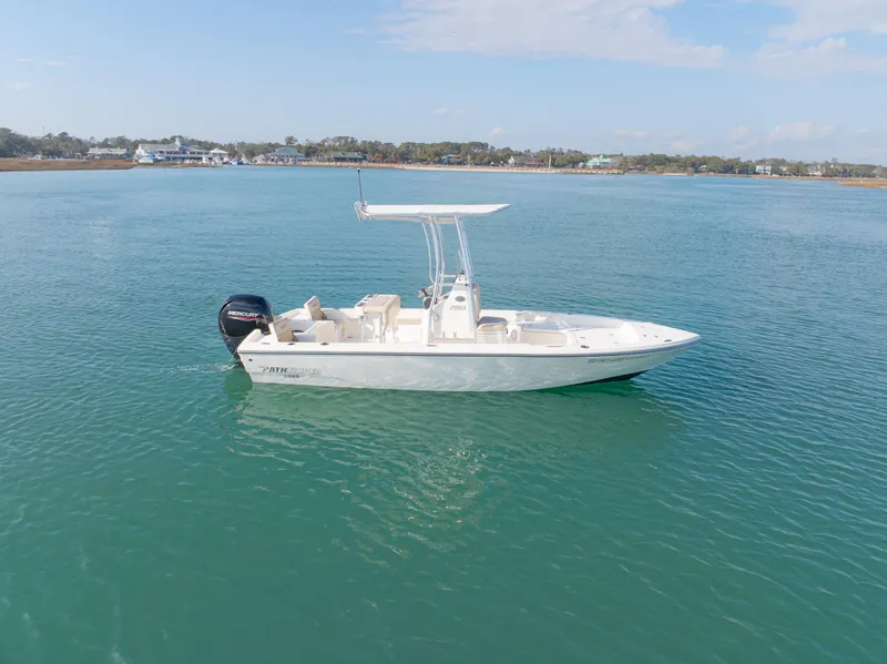 Slide: The Image of Pathfinder 2005 TRS boat on calm water, 2022 model, clear sky background. - 6