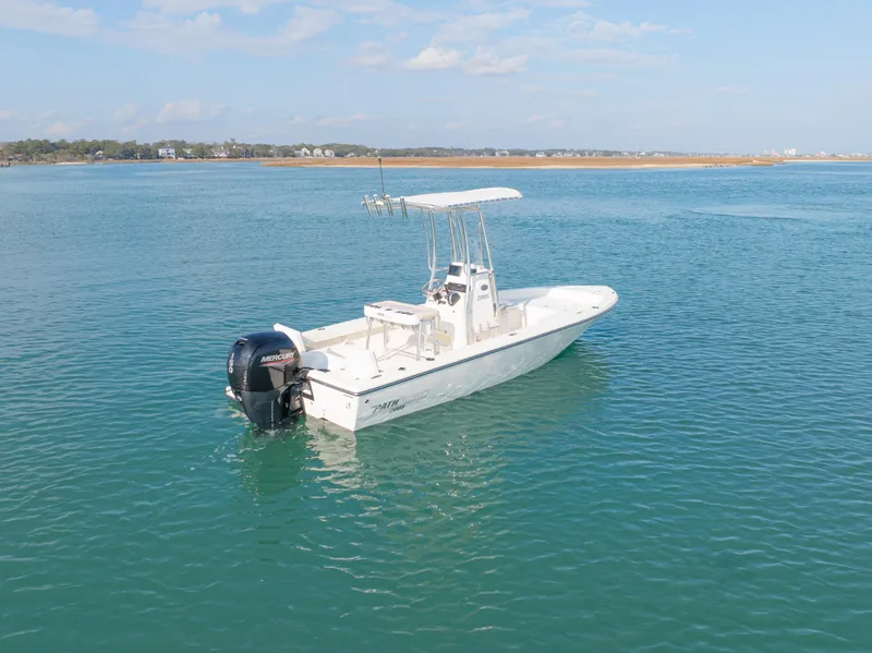 Slide: The Image of Pathfinder 2005 TRS boat on calm water, 2022 model, clear sky background. - 7