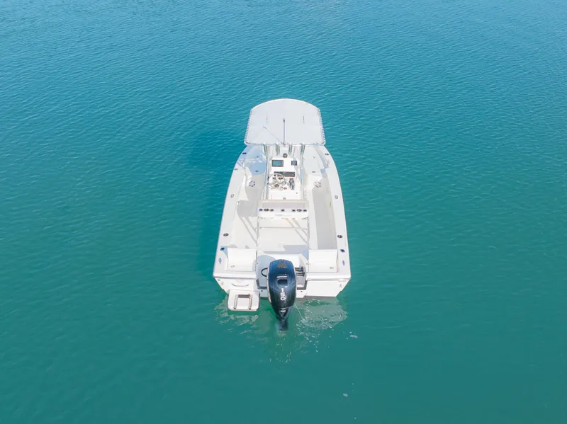 Slide: The Image of Aerial view of 2022 Pathfinder 2005 TRS boat on calm blue water. - 8