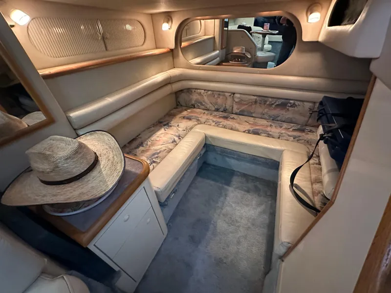 Slide: The Image of Interior of 1996 Sea Ray 330 Sundancer yacht with cozy seating and ambient lighting. - 36
