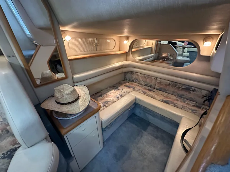 Slide: The Image of Interior of 1996 Sea Ray 330 Sundancer with cozy seating and ambient lighting. - 37