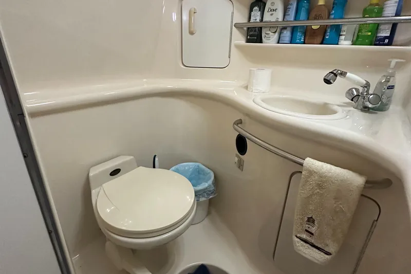 Slide: The Image of Bathroom interior of 1996 Sea Ray 330 Sundancer yacht with sink and toiletries. - 39