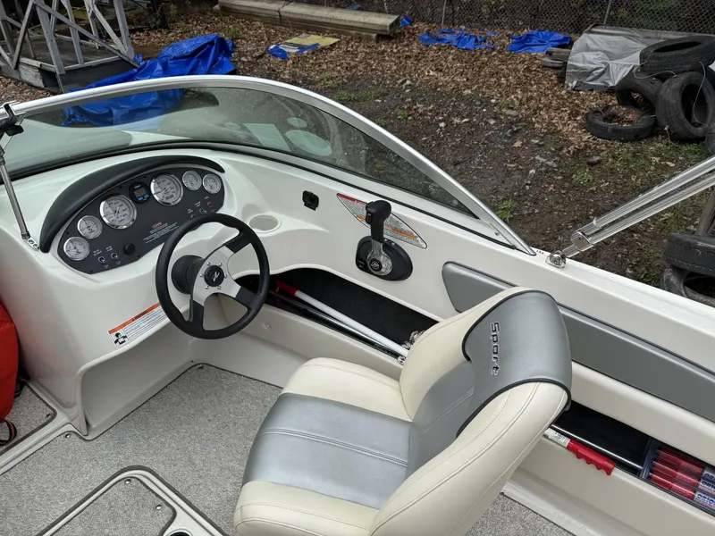 Slide: The Image of 2009 Sea Ray 175 Sport boat interior with steering wheel and dashboard controls. - 7