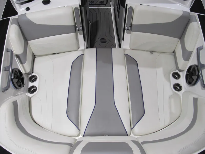 Slide: The Image of 2017 Malibu 22 MXZ boat interior with gray and white seating. - 12