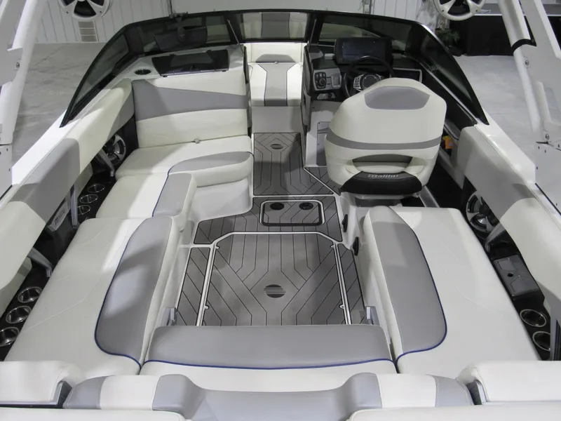 Slide: The Image of 2017 Malibu 22 MXZ boat interior with sleek seating and modern design. - 3