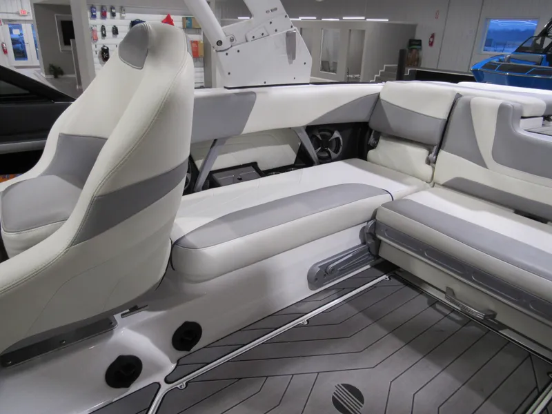 Slide: The Image of Interior of a 2017 Malibu 22 MXZ boat with white and gray seating. - 7
