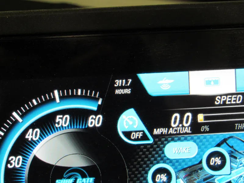 Slide: The Image of Dashboard of a 2017 Malibu 22 MXZ showing 311.7 hours and speedometer. - 9