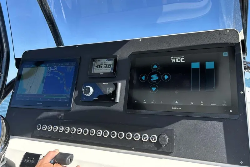 Slide: The Image of Dashboard of 2026 Key West 291 FS boat with advanced navigation displays. - 10
