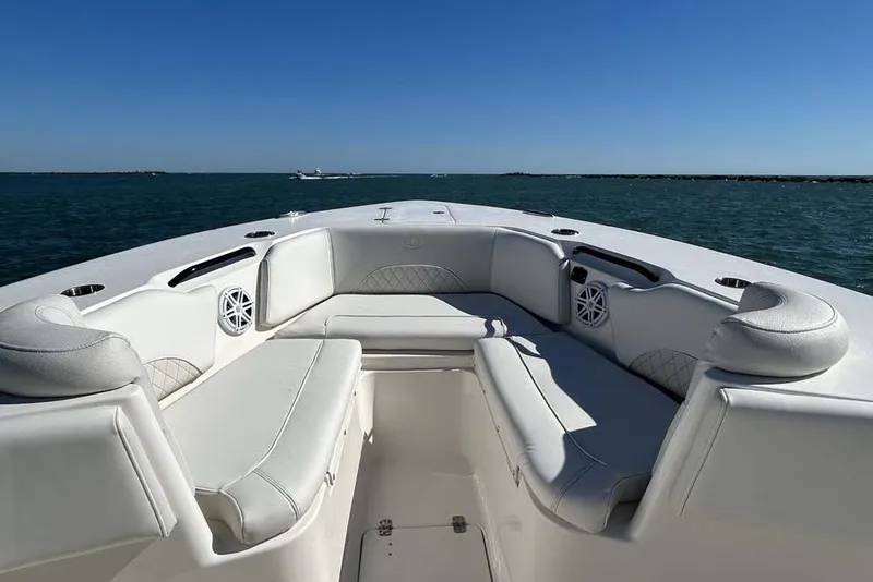 Slide: The Image of 2026 Key West 291 FS boat interior with white seating, ocean view. - 13