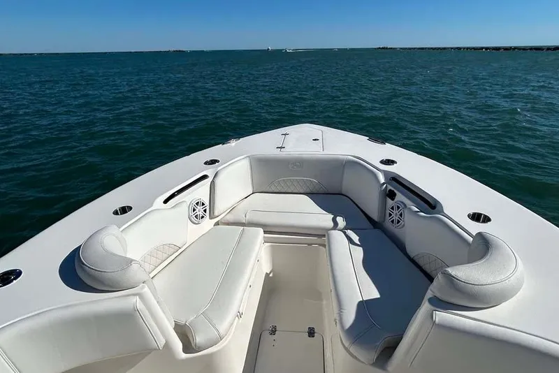 Slide: The Image of 2026 Key West 291 FS boat interior with white seating on open water. - 14