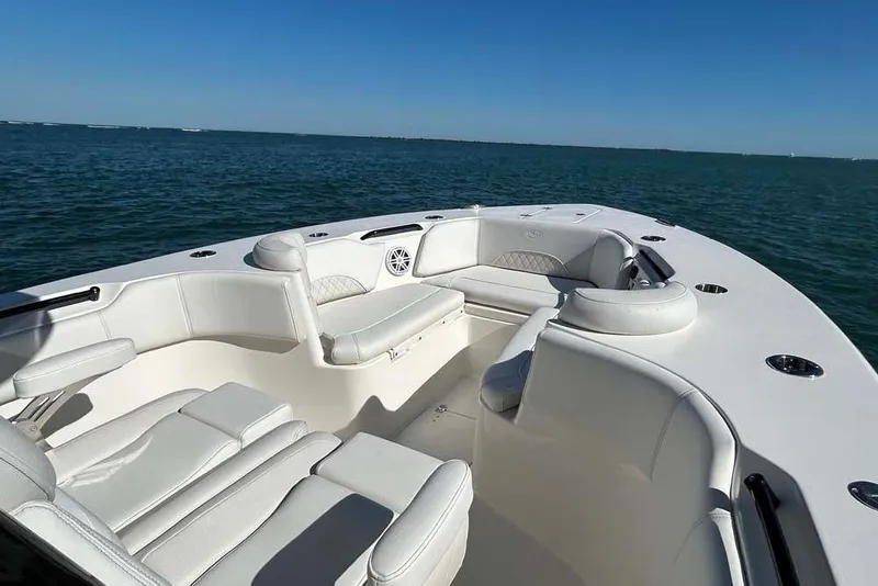 Slide: The Image of 2026 Key West 291 FS boat interior with white seating on open water. - 15