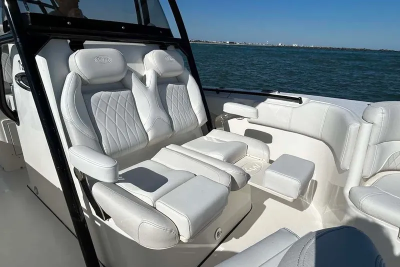 Slide: The Image of 2026 Key West 291 FS boat interior with luxurious white seating. - 18