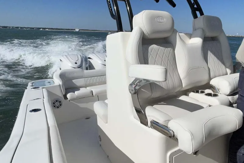 Slide: The Image of 2026 Key West 291 FS boat interior with luxurious seating on open water. - 19